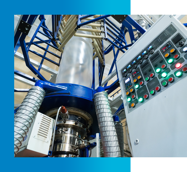 Plastic manufacturing machinery with control panel and extrusion process.